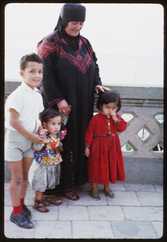 "Local children and woman."